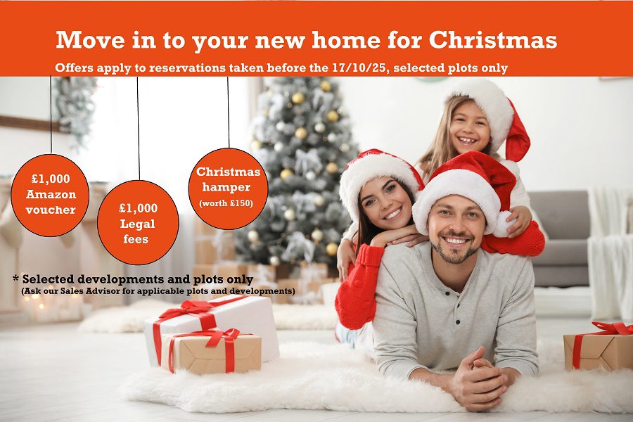 Portrait,of,happy,family,with,christmas,gifts,on,floor,at